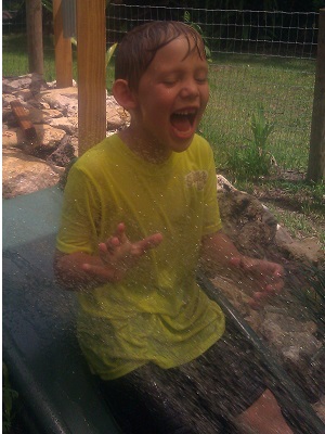 Slide outdoor area with water hose